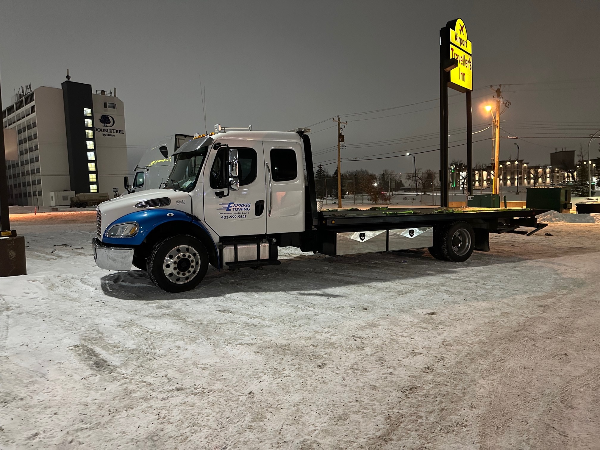 Express Towing flat deck tow truck